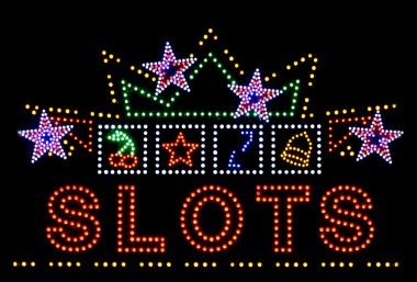 Slot game interface showing reels and payout table